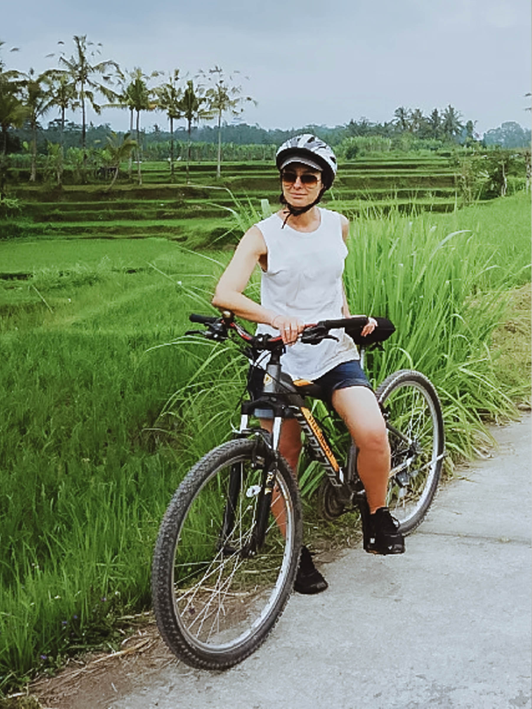 A tranquil cycle ride through the lush gardens and nature lands of Jaffna, surrounded by vibrant greenery, blooming flowers, and scenic landscapes.
