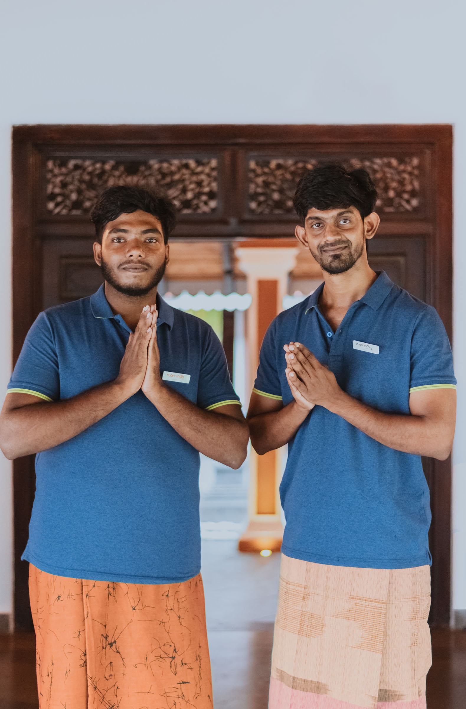 The Flamingo Villa team warmly welcoming guests at the entrance, showcasing their hospitality and friendly service in Jaffna, Sri Lanka.