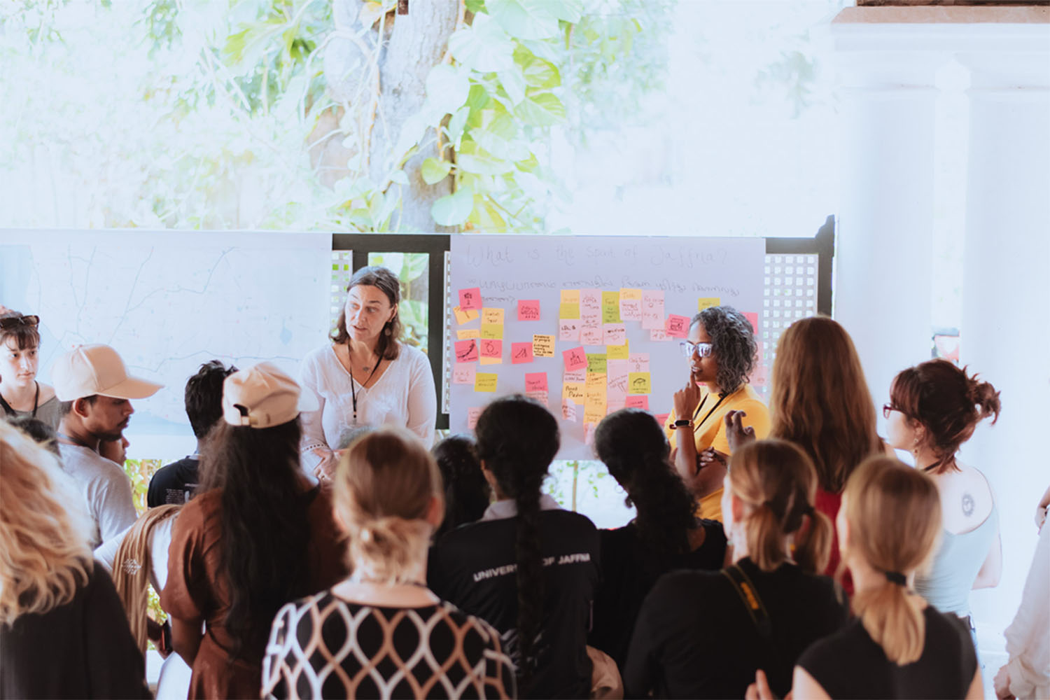 A group of people actively participating in a workshop, collaborating, and learning together in an interactive and engaging environment.